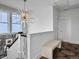 Bright upstairs landing featuring modern light fixture, a bench, and a stairway at 2524 Josiah St, Charleston, SC 29492