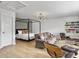 Bright living room featuring a modern light fixture, comfortable seating, and a stylish four-poster bed at 2524 Josiah St, Charleston, SC 29492
