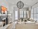 Cozy living room featuring a fireplace, TV, modern lighting, and plush seating at 2524 Josiah St, Charleston, SC 29492