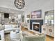 Open-concept living area with fireplace, TV, modern lighting, and connection to the kitchen at 2524 Josiah St, Charleston, SC 29492