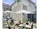 Charming outdoor patio with dining and living spaces and views of the home's exterior at 2524 Josiah St, Charleston, SC 29492