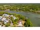 Picturesque aerial view of a waterfront home nestled in a charming neighborhood with lush greenery and river views at 2538 Helmsman Rd, Johns Island, SC 29455