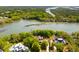 Breathtaking aerial view of waterfront homes, lush forests, and winding waterways at 2538 Helmsman Rd, Johns Island, SC 29455