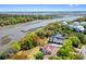 Scenic aerial view of waterfront homes surrounded by lush green trees and waterways at 2538 Helmsman Rd, Johns Island, SC 29455