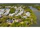 Beautiful aerial view of a charming neighborhood with waterfront homes surrounded by lush greenery and serene waters at 2538 Helmsman Rd, Johns Island, SC 29455