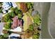 Stunning aerial view of a waterfront home with a lush green lawn, outdoor living and river views at 2538 Helmsman Rd, Johns Island, SC 29455