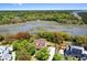 Breathtaking aerial view of charming waterfront home with lush landscaping and private access to the water at 2538 Helmsman Rd, Johns Island, SC 29455