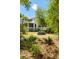 Expansive backyard featuring a stylish outdoor seating area amidst lush landscaping at 2538 Helmsman Rd, Johns Island, SC 29455