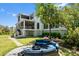 Grassy backyard with an outdoor lounge area and lush surrounding greenery at 2538 Helmsman Rd, Johns Island, SC 29455