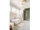 Bright bathroom featuring a soaking tub, walk-in shower, and natural light at 2538 Helmsman Rd, Johns Island, SC 29455