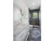 Elegant bathroom with a marble vanity, modern fixtures, and a glass-enclosed shower at 2538 Helmsman Rd, Johns Island, SC 29455