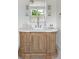 Bathroom vanity features a wooden cabinet with white countertop and modern fixtures at 2538 Helmsman Rd, Johns Island, SC 29455