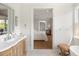 Bathroom view leads into the main bedroom, offering a seamless and luxurious flow at 2538 Helmsman Rd, Johns Island, SC 29455