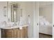 Luxurious bathroom and vanity with decorative mirror, door to bedroom on the side at 2538 Helmsman Rd, Johns Island, SC 29455