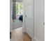 Bedroom doorway with view of bed, blue rug, and window with blue curtains at 2538 Helmsman Rd, Johns Island, SC 29455