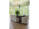 Well-lit dining area with an elegant wooden table and chairs under a modern chandelier at 2538 Helmsman Rd, Johns Island, SC 29455