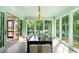 Open dining area features a dark wooden table with seating, light-green walls, and serene atmosphere at 2538 Helmsman Rd, Johns Island, SC 29455