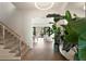 Beautiful home entryway with wood stairs, herringbone floors, and elegant decor elements creates a welcoming and stylish entry at 2538 Helmsman Rd, Johns Island, SC 29455