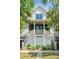Inviting home exterior with a charming porch and double staircases leading to the front entrance at 2538 Helmsman Rd, Johns Island, SC 29455