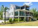 Stately home exterior featuring multiple stories and inviting screened-in porches at 2538 Helmsman Rd, Johns Island, SC 29455