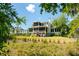 Charming home exterior with screened porch overlooking a beautifully landscaped yard at 2538 Helmsman Rd, Johns Island, SC 29455