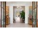 Grand foyer with elegant lighting, hardwood floors, and stylish decor at 2538 Helmsman Rd, Johns Island, SC 29455