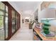 Bright hallway with decorative furnishings and wood-framed glass paneled doors at 2538 Helmsman Rd, Johns Island, SC 29455