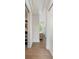 Bright hallway featuring hardwood floors, an open closet, and a window view at 2538 Helmsman Rd, Johns Island, SC 29455