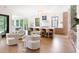 Open kitchen boasts marble countertops, a large island with bar seating, and modern appliances for culinary enthusiasts at 2538 Helmsman Rd, Johns Island, SC 29455