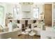 Bright, open kitchen featuring a large marble island, counter seating, and modern finishes at 2538 Helmsman Rd, Johns Island, SC 29455