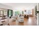 Bright living area flows into kitchen with island seating, creating a sociable, open-concept design perfect for modern living at 2538 Helmsman Rd, Johns Island, SC 29455