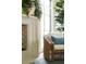 Cozy corner view of fireplace with rattan chair in sunlit living room at 2538 Helmsman Rd, Johns Island, SC 29455