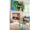 Fireplace with decor, rattan chair and glass topped coffee table in sunlit living room at 2538 Helmsman Rd, Johns Island, SC 29455