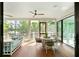Relaxing screened-in patio with stylish seating and views of the lush backyard at 2538 Helmsman Rd, Johns Island, SC 29455