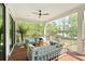 Covered patio with stylish seating and views of lush greenery, perfect for relaxation at 2538 Helmsman Rd, Johns Island, SC 29455