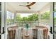 Lovely porch with wicker chairs and view of the green outdoors at 2538 Helmsman Rd, Johns Island, SC 29455