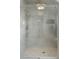 Luxurious shower featuring marble-like tile, dual shower heads, and a frameless glass enclosure at 2538 Helmsman Rd, Johns Island, SC 29455