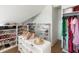 Bright walk-in closet features ample shelving and storage for shoes, hats and clothing at 2538 Helmsman Rd, Johns Island, SC 29455