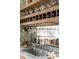 Elegant wet bar features marble countertop, wine rack, and glassware storage at 2538 Helmsman Rd, Johns Island, SC 29455