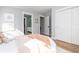 A cozy bedroom featuring hardwood flooring, neutral walls, and sun-drenched natural light at 301 Beaufort St, Summerville, SC 29483