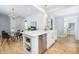 Kitchen with island, stainless steel dishwasher, and dining area, all enhanced by natural light at 301 Beaufort St, Summerville, SC 29483