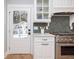Kitchen features stainless appliances, herringbone backsplash, and view of the backyard at 301 Beaufort St, Summerville, SC 29483