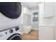 Well-organized laundry room with modern washer/dryer, storage cabinets, and a functional bench at 301 Beaufort St, Summerville, SC 29483