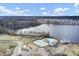 Gorgeous aerial view of the community pool, playground, and amenity center alongside a lake and pond at 330 Albrighton Way, Moncks Corner, SC 29461