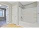 Bathroom with a shower and tub combo, tiled floor, and a white door leading to another room at 330 Albrighton Way, Moncks Corner, SC 29461