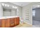 Bathroom with double vanity, a large mirror, and ample storage space at 330 Albrighton Way, Moncks Corner, SC 29461