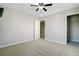 This bedroom has neutral walls, carpeted flooring, and two entrances, one to a closet with shelving at 330 Albrighton Way, Moncks Corner, SC 29461