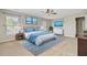 Bright bedroom featuring a ceiling fan, carpet floors, and lots of natural light from multiple windows at 330 Albrighton Way, Moncks Corner, SC 29461