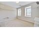 Bedroom with closet shelving, carpet flooring, and lots of natural light from two windows at 330 Albrighton Way, Moncks Corner, SC 29461