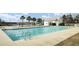 Sparkling community pool with palm trees and a white pergola in a residential neighborhood, great for relaxation at 330 Albrighton Way, Moncks Corner, SC 29461